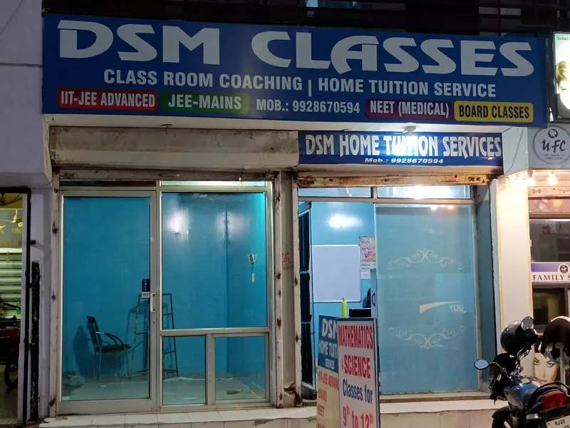 Close view of the DSM Classes entrance and its blue signboard reading Class Room Coaching and Home Tuition Service