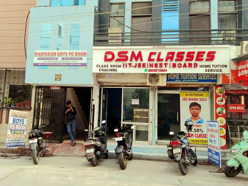 The DSM Classes signboard and entrance on the street in Kota